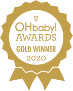 Happy baby wanting more biscuits