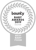 Happy baby wanting more biscuits