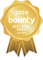 Happy baby wanting more biscuits