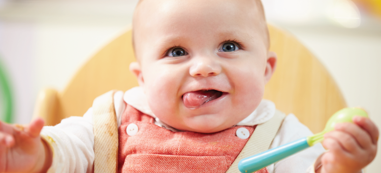 Happy baby feeding