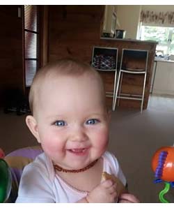 Happy Baby eating Rice Rusk