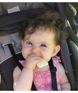 Happy Baby eating Rice Rusk